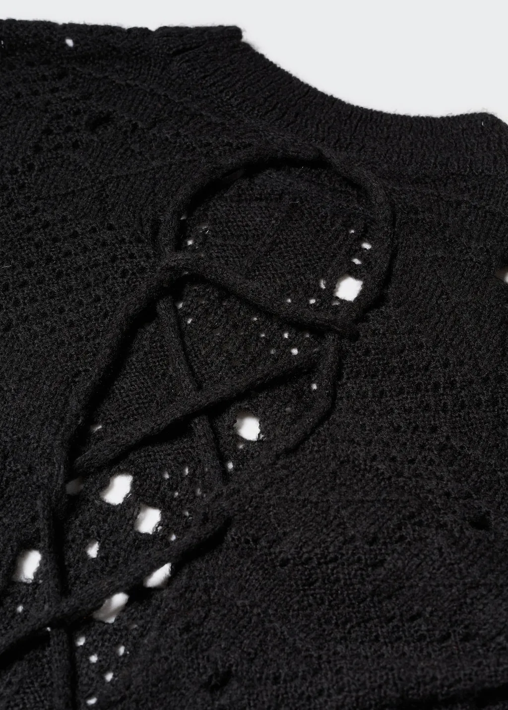 Pullover traforato schiena scoperta